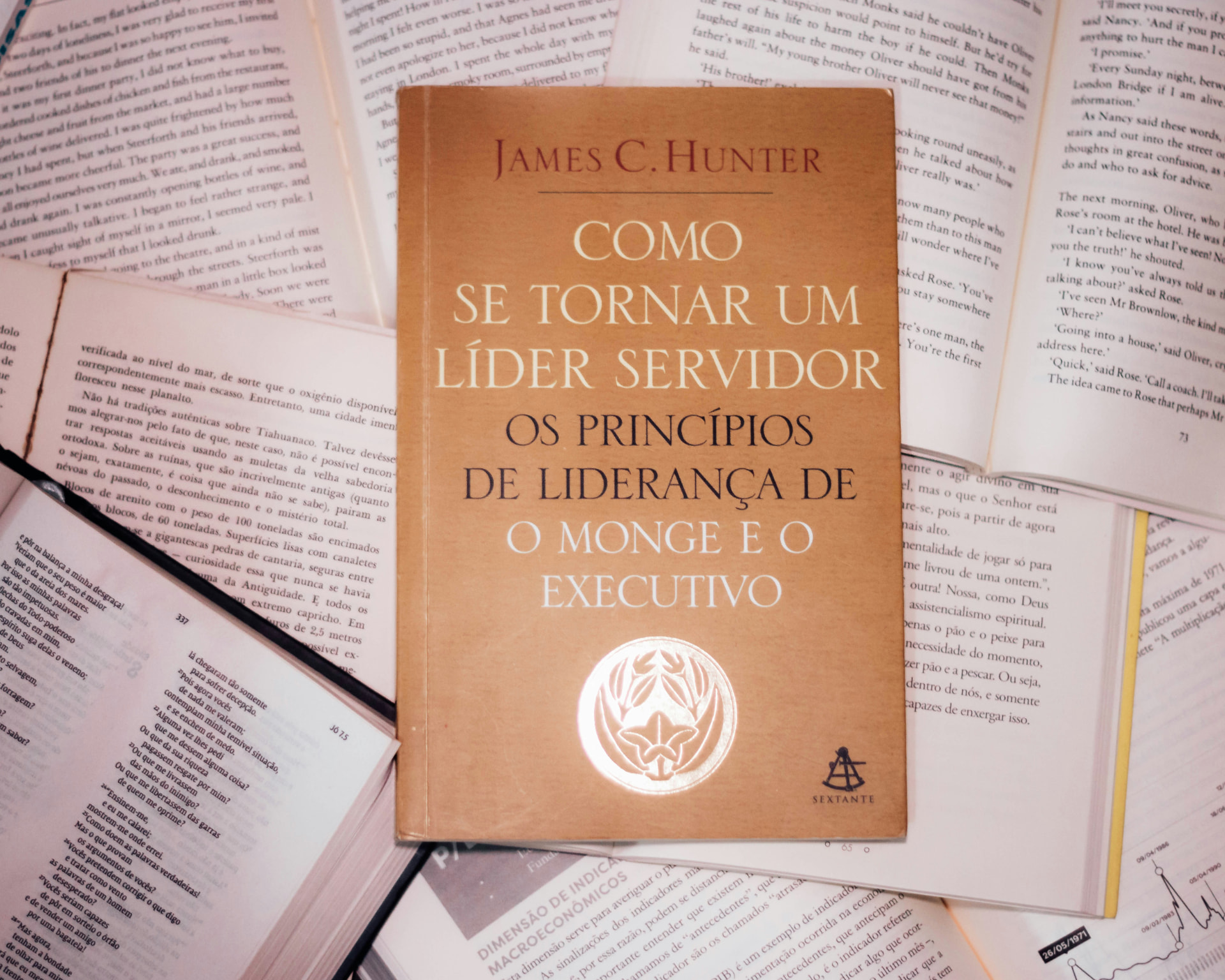 A single book laid over many open books